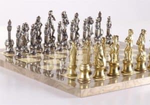 gold and silver metal chess sets